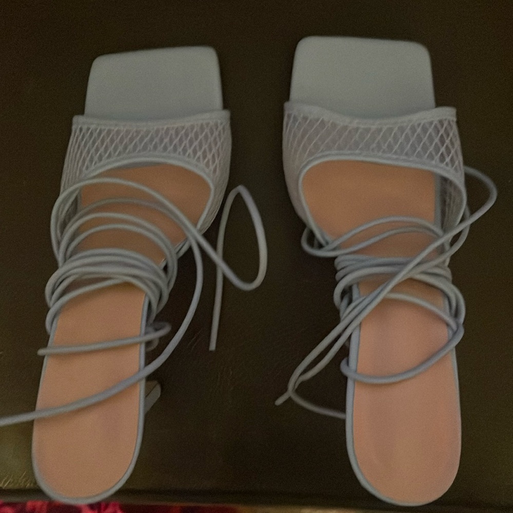 Brand new Blue lace up/strap open toed heels.